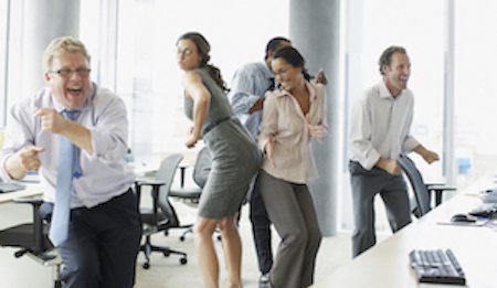 happy employees dancing in the office