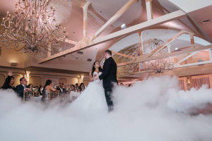 Bride and groom practicing a ballroom frame during private wedding dance lessons