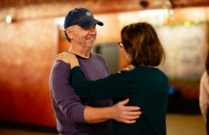 Man and Woman practicing during a Couples dance lessons