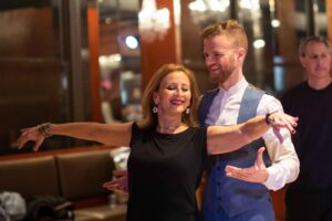 teaching a student salsa footwork during a private lesson at Dance With Me Midtown NYC