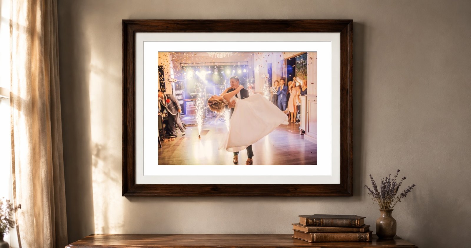 A framed first dance photograph hanging above a console table at home