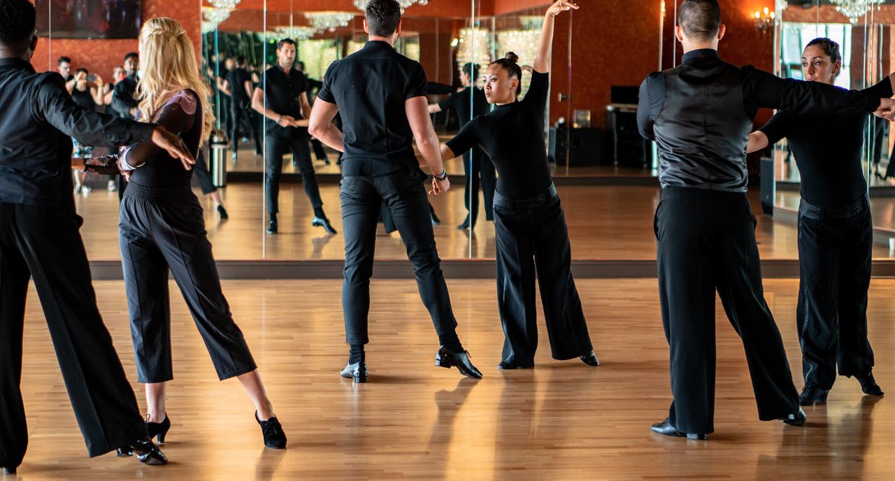 Couples dancing in closed hold during a class at Dance With Me Buckhead, Atlanta