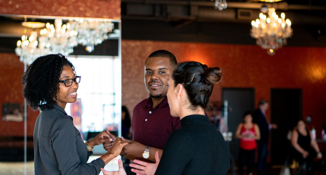 Instructor coaching a couple through a private dance lesson at Dance With Me Buckhead, Atlanta