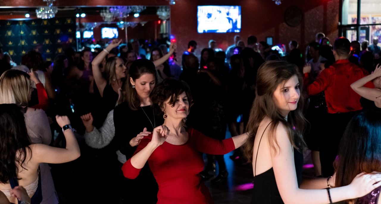 Students and instructors on the floor at a Dance With Me Buckhead social dance party